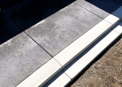 Stamped concrete patio finished with an Oxford Slate pattern. Durable, low-maintenance, and ideal for outdoor living spaces across Victoria and Vancouver Island.