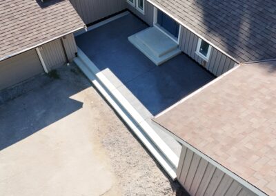 Stamped concrete patio finished with an Oxford Slate pattern. Durable, low-maintenance, and ideal for outdoor living spaces across Victoria and Vancouver Island.