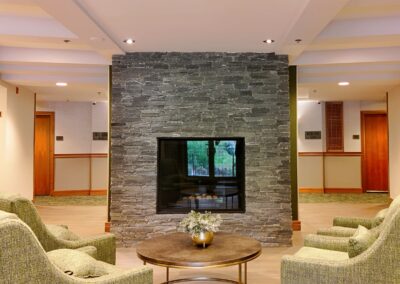 Stone fireplace installation at Fairways Hotel by Orca Masonry using natural K2 Stone veneer.