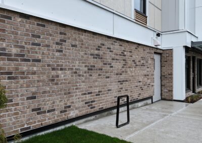 Completed commercial CMU block and brick veneer masonry at 2120 Quadra Street, Victoria, BC – project by Orca Masonry