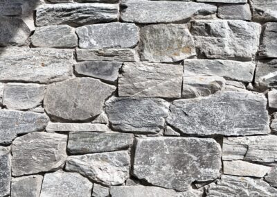 Exterior view of natural stone veneer installation using Ocean Mist stone from K2 Stone at a mixed-use development on 713 St. Patrick Street in Oak Bay.