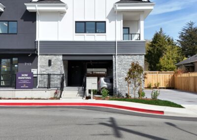 Exterior view of natural stone veneer installation using Ocean Mist stone from K2 Stone at a mixed-use development on 713 St. Patrick Street in Oak Bay