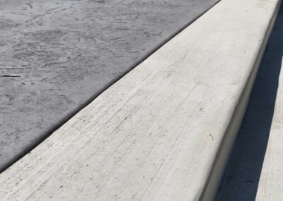 Stamped concrete patio finished with an Oxford Slate pattern. Durable, low-maintenance, and ideal for outdoor living spaces across Victoria and Vancouver Island.