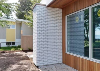 Exterior white brick façade on modern custom home in Victoria by Orca Masonry