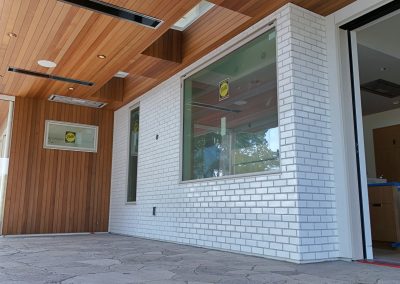 Exterior white brick façade on modern custom home in Victoria by Orca Masonry