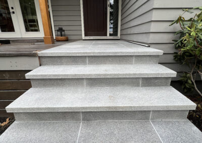 Premium grey granite steps and walkway installed for a modern outdoor space in Victoria, BC.