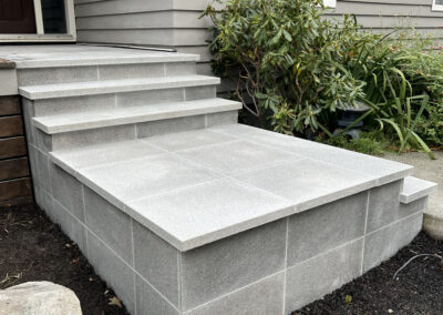 Premium grey granite steps and walkway installed for a modern outdoor space in Victoria, BC.