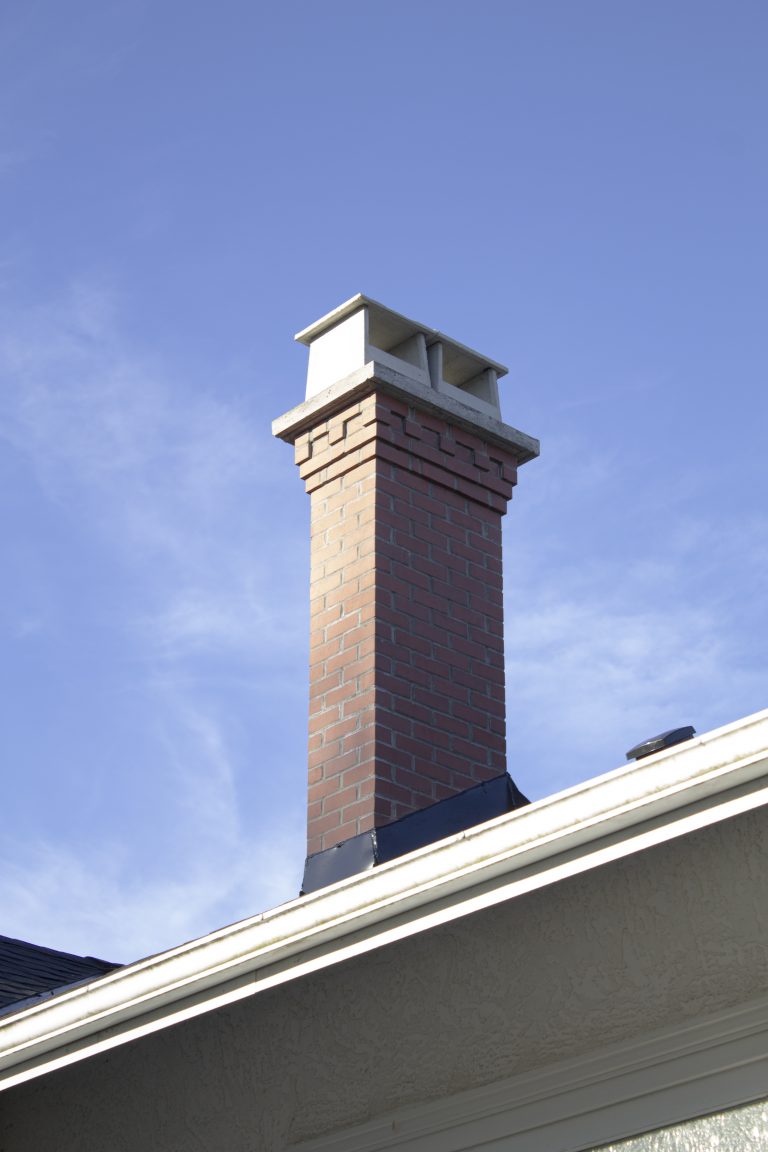 Inca red brick chimney with corbel and castle top detail
