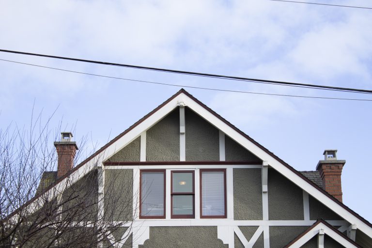 Two heritage red brick chimneys on a character home