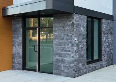 Expert stone veneer cladding for commercial projects, ensuring durability and waterproofing.