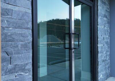 Expert stone veneer cladding for commercial projects, ensuring durability and waterproofing.