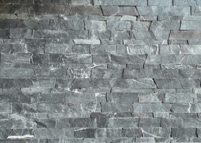 Expert stone veneer cladding for commercial projects, ensuring durability and waterproofing.