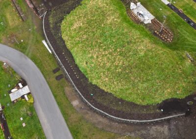 Natural stone retaining wall in Victoria, BC, built for erosion control and landscaping.