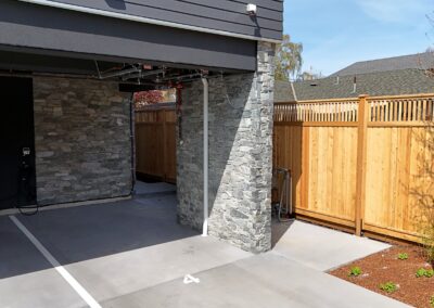 Exterior view of natural stone veneer installation using Ocean Mist stone from K2 Stone at a mixed-use development on 713 St. Patrick Street in Oak Bay