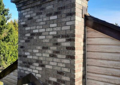 Chimney Rebuild With Multi-Tone Brick and Concrete Crown