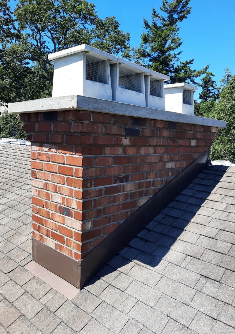 Mutual used brick chimney with corbel and concrete crown
