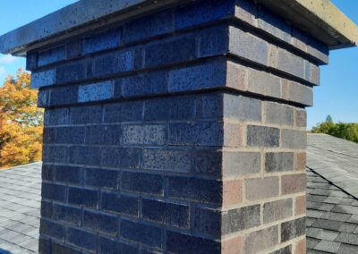 Dark Flashed Brick With Corbel and Concrete Crown