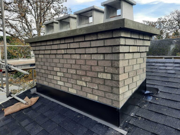 Chateau Gray textured brick chimney with a corbel and concrete crown