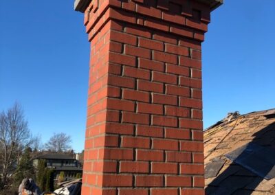Heritage Red Brick Chimney With Corbel and Concrete Cap