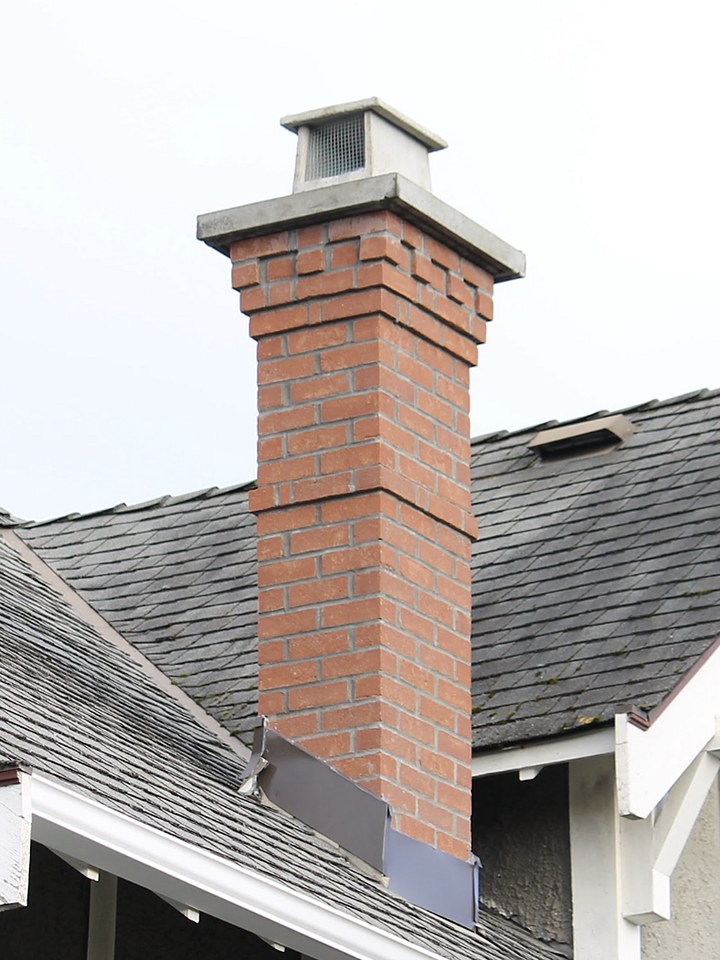 Heritage Brick chimney rebuilt by Orca Masonry