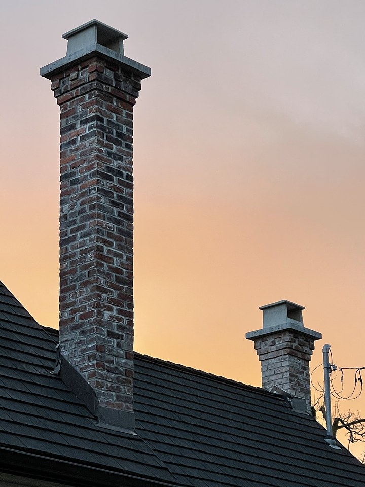 Reclaimed Brick chimney rebuilt by Orca Masonry