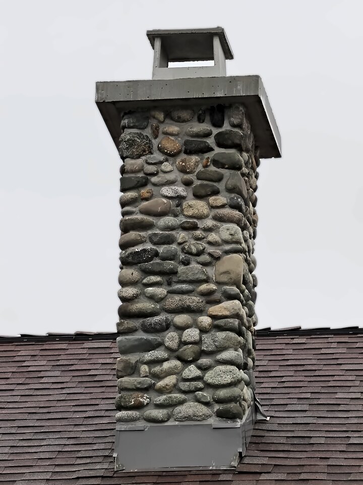 River Rock chimney rebuilt by Orca Masonry