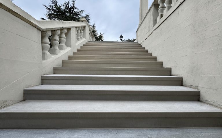 A flight of steps beside a balustrade, finished in StepClad